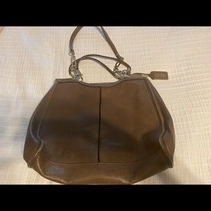 Brown Coach purse with light blue lining